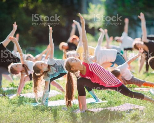 Yoga classes outside on the open air. Kids Yoga